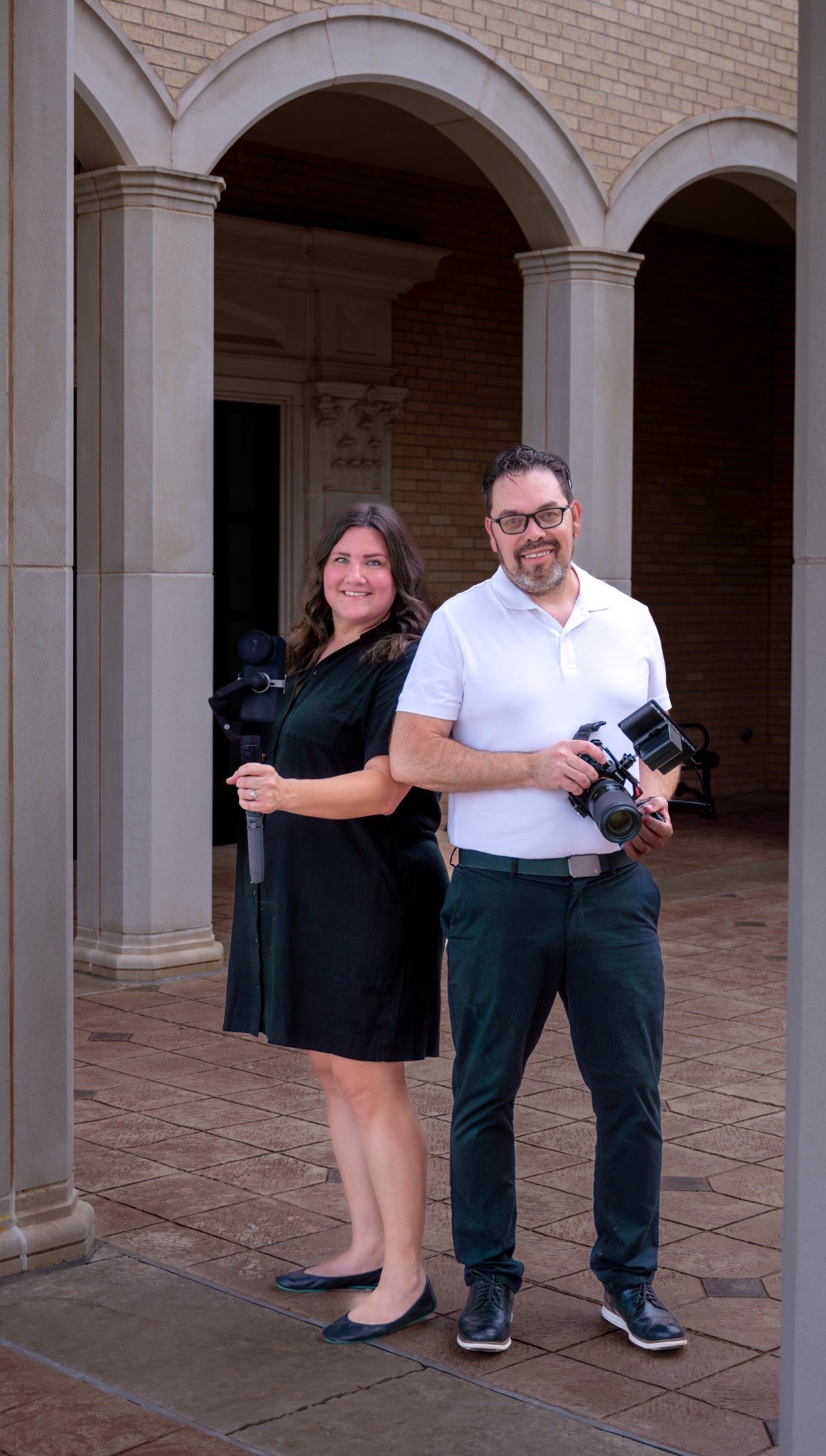 Amber and Shawn Bustamante holding video production equipment